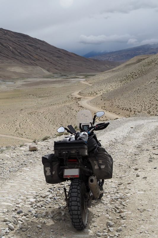 Motorcycle riding towards Langar in the Wakhan Valley, Tajikistan