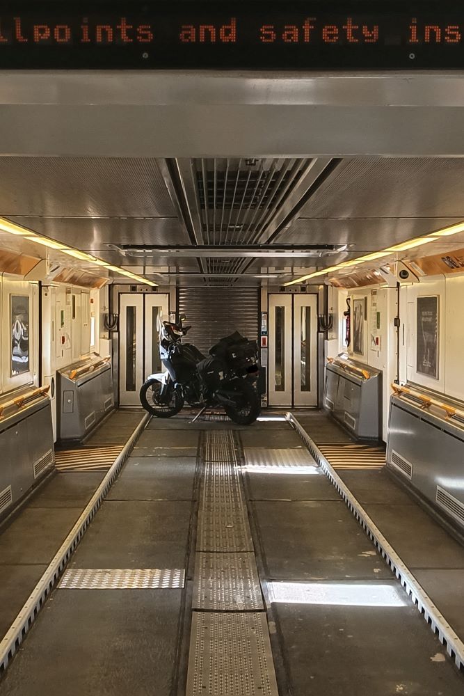 A lone motorcycle in a Eurotunnel carriage