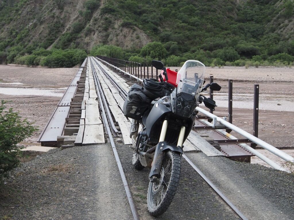 Motorcycle crossing old railway bridge Sucre to Potosi near crossing Rio Pilcomayo near Kilometro 12