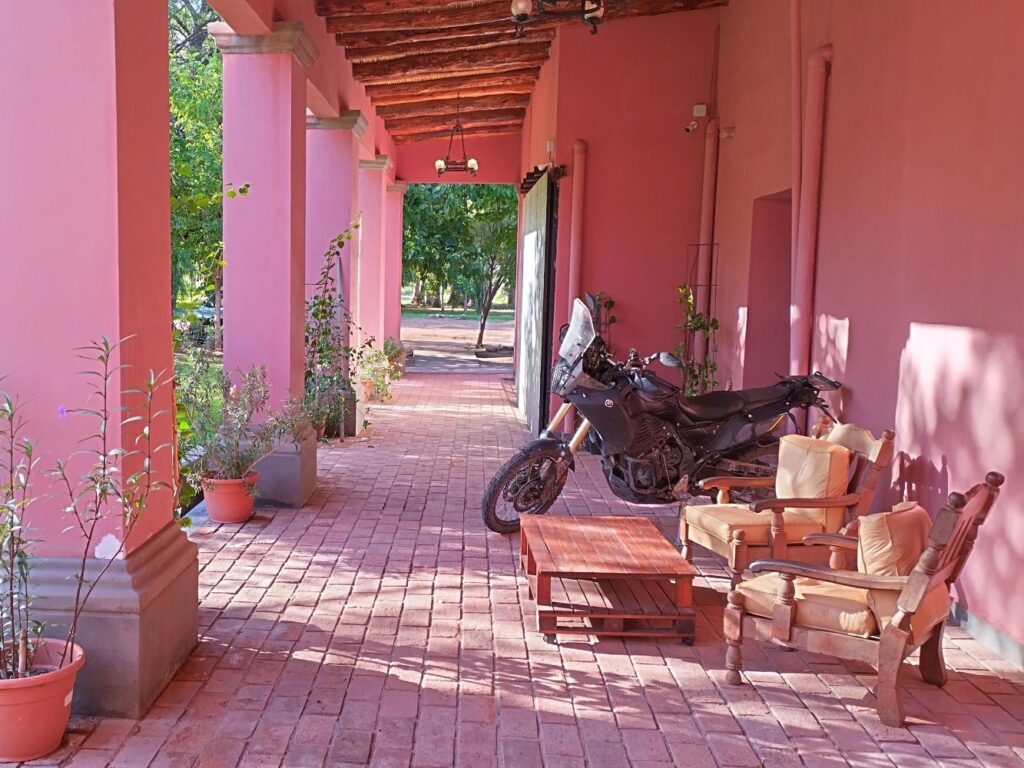 Motorcycle parked inside Tinogasta Finca la Sala, Argentina